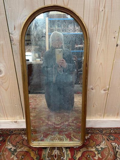 Small golden mirror between two in style Louis Philippe