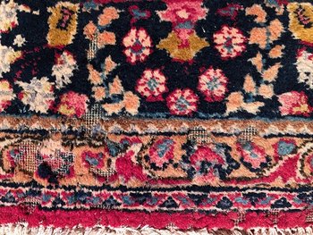 Iranian wool carpet with central medallion decoration on pink background