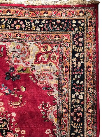 Iranian wool carpet with central medallion decoration on pink background