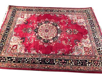 Iranian wool carpet with central medallion decoration on pink background