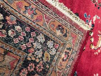 Iranian wool carpet with central medallion decoration on pink background