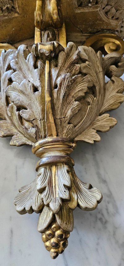 Pair of lacquered and gilded wooden wall consoles, 18th century.