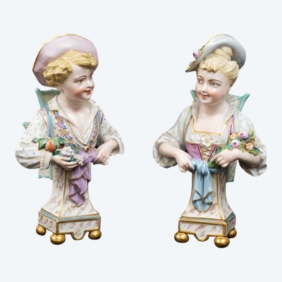 Pair of porcelain flower-bearing sculptures, Germany, early 20th century.