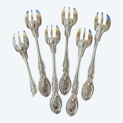 6 oyster forks.