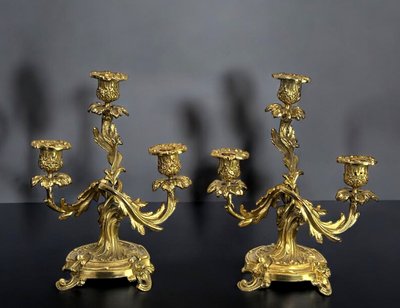 PAIR OF LATE 19TH CENTURY GILT-BRONZE THREE-BRANCH CANDLESTICKS IN LOUIS XV STYLE