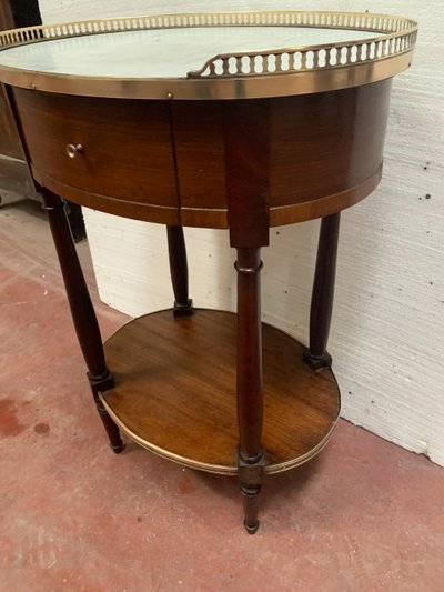 Louis XVI style oval coffee table in mahogany and marble, 19th century