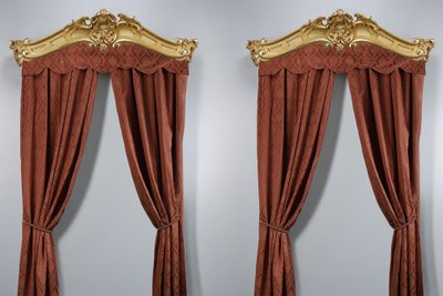 IMPORTANT PAIR OF CARVED AND GILDED WOOD WINDOW VALANCES