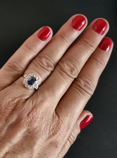 Ring adorned with a sapphire and diamonds, gold and platinum.