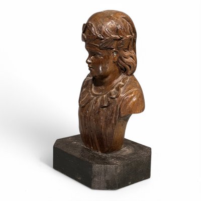 Carved wooden half-bust