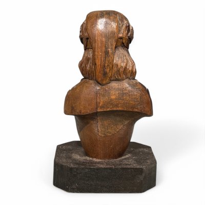 Carved wooden half-bust