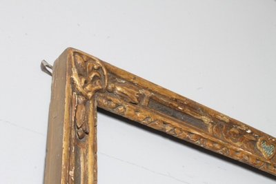 Antique large frame from the 1750s. Gilded and painted with carvings. Size 215 x 98