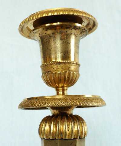 Ravrio: pair of Empire candlesticks in mercury-gilded bronze, early 19th century