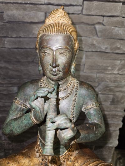 Statuette of Buddha playing the flute - Bronze - Early 20th century -