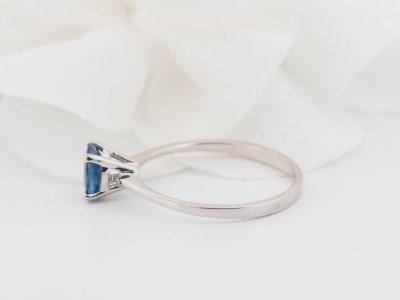 White gold and oval sapphire solitaire ring