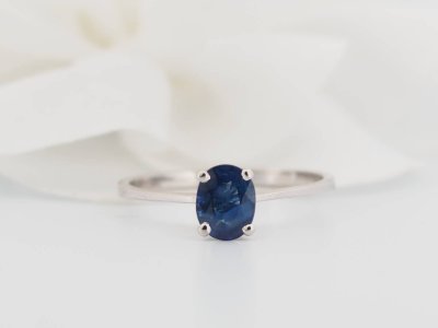 White gold and oval sapphire solitaire ring