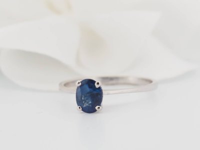 White gold and oval sapphire solitaire ring