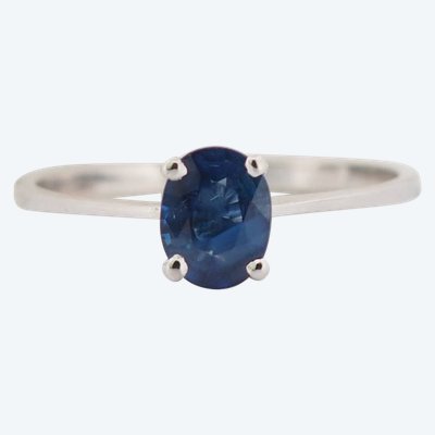 White gold and oval sapphire solitaire ring