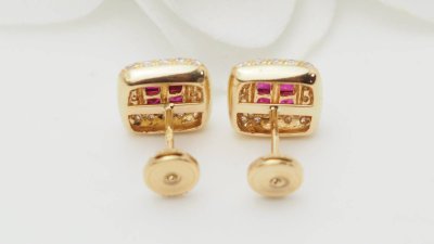 Luxury earrings in yellow gold, rubies and diamonds