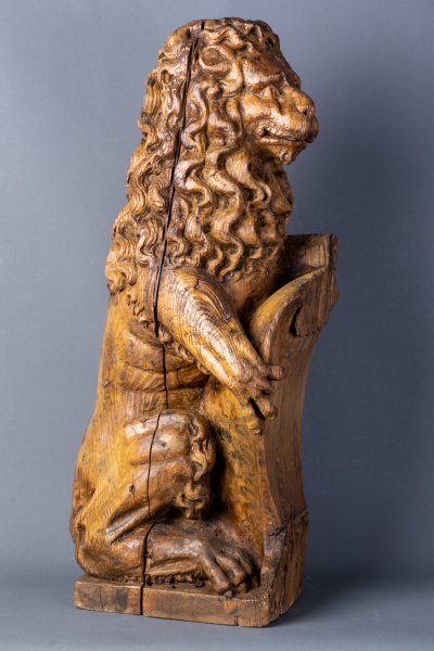 Lion holding a shield