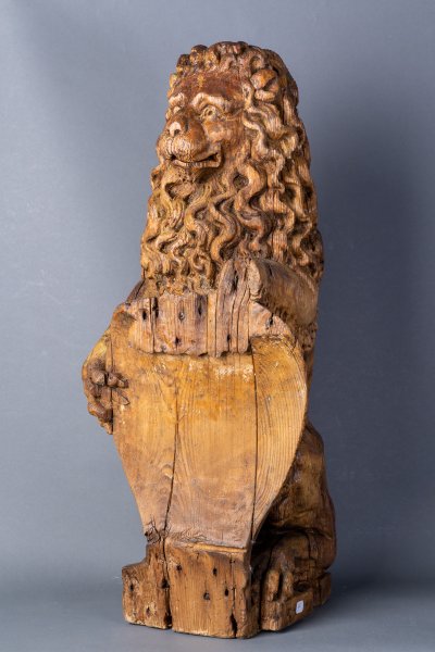 Lion holding a shield