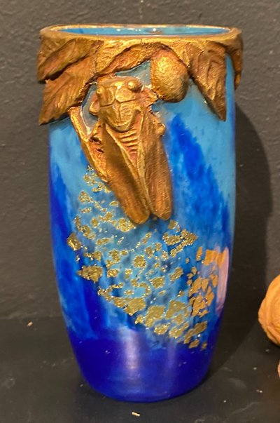 Daum vase with cicada motif and gold leaf inclusionCrystal vase with a blue nuanced backgroun