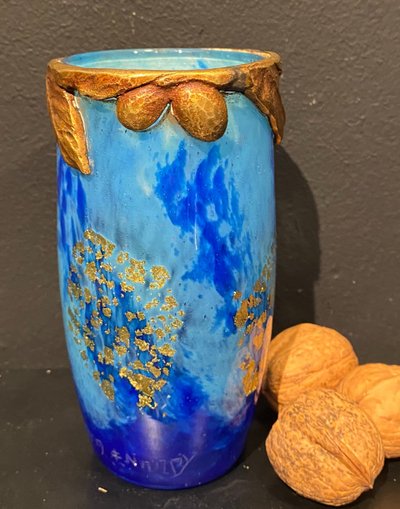 Daum vase with cicada motif and gold leaf inclusionCrystal vase with a blue nuanced backgroun