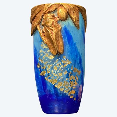 Daum vase with cicada motif and gold leaf inclusionCrystal vase with a blue nuanced backgroun