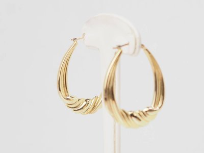 Twisted creole earrings in yellow gold