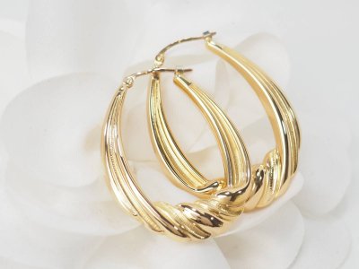 Twisted creole earrings in yellow gold