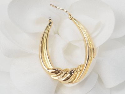 Twisted creole earrings in yellow gold