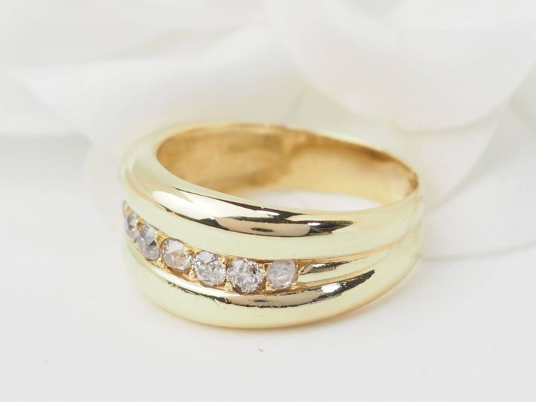 Yellow gold and diamond bangle ring