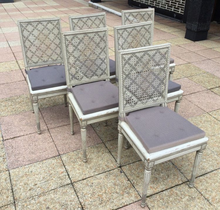 Set of six Louis XVI caned chairs in rechampi wood.