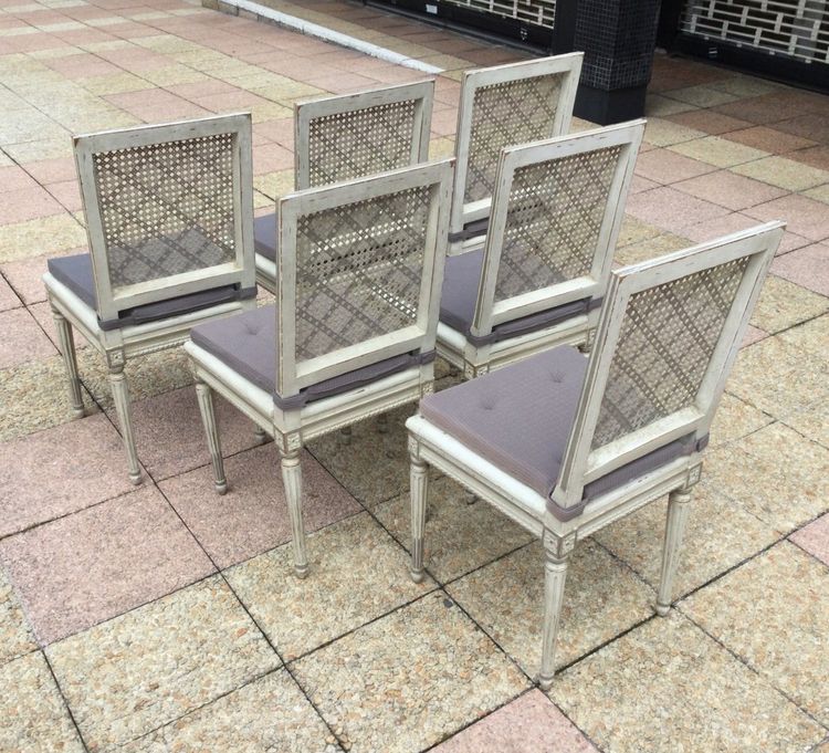 Set of six Louis XVI caned chairs in rechampi wood.