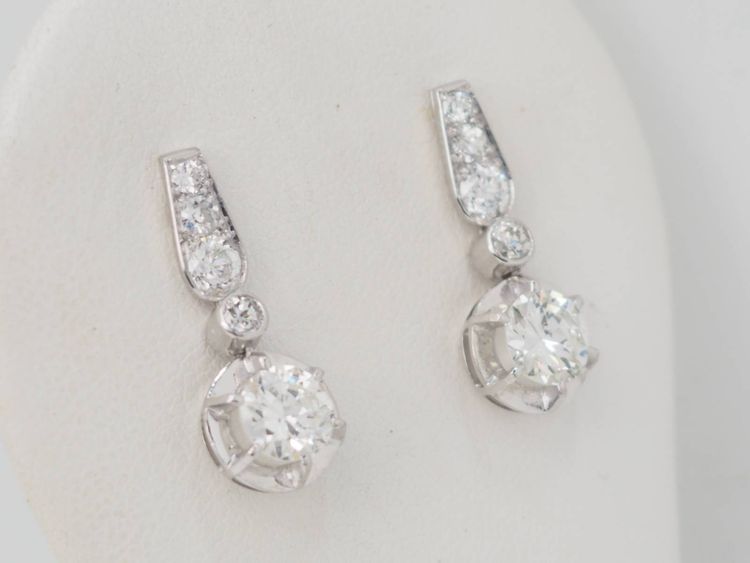 Pair of antique sleeper earrings in white gold and diamonds