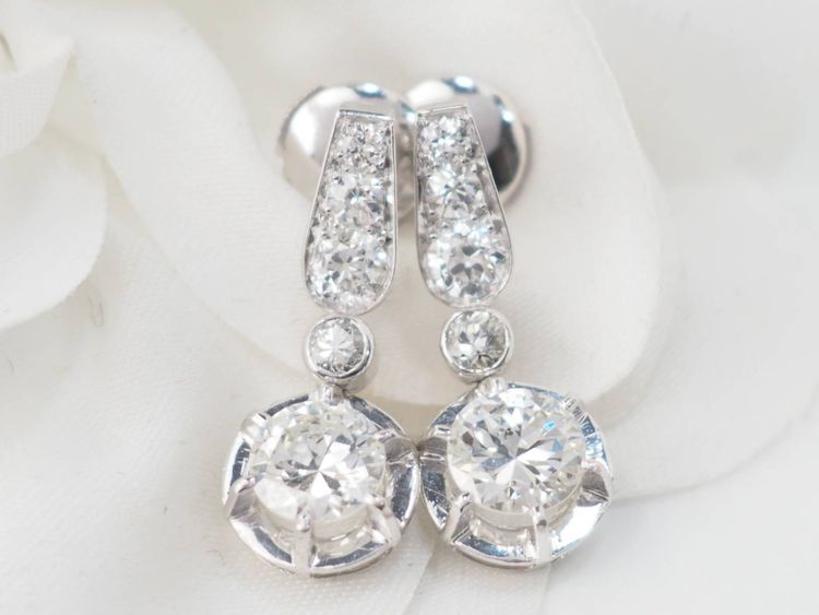 Pair of antique sleeper earrings in white gold and diamonds