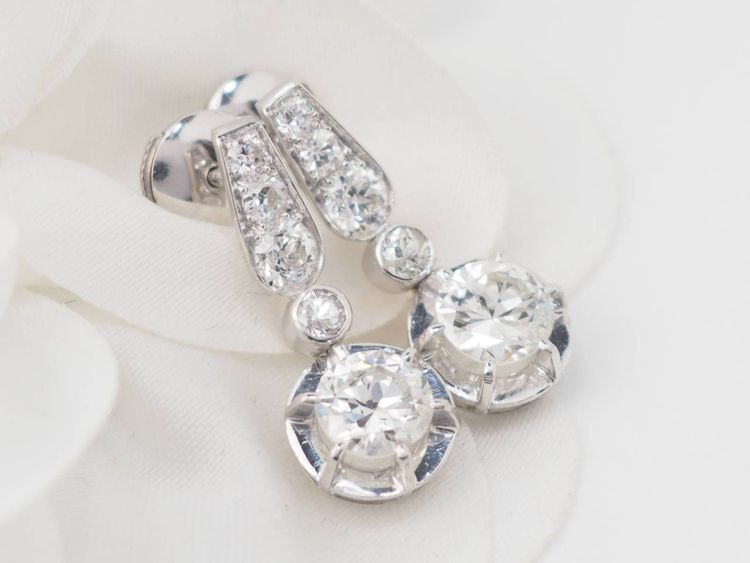 Pair of antique sleeper earrings in white gold and diamonds