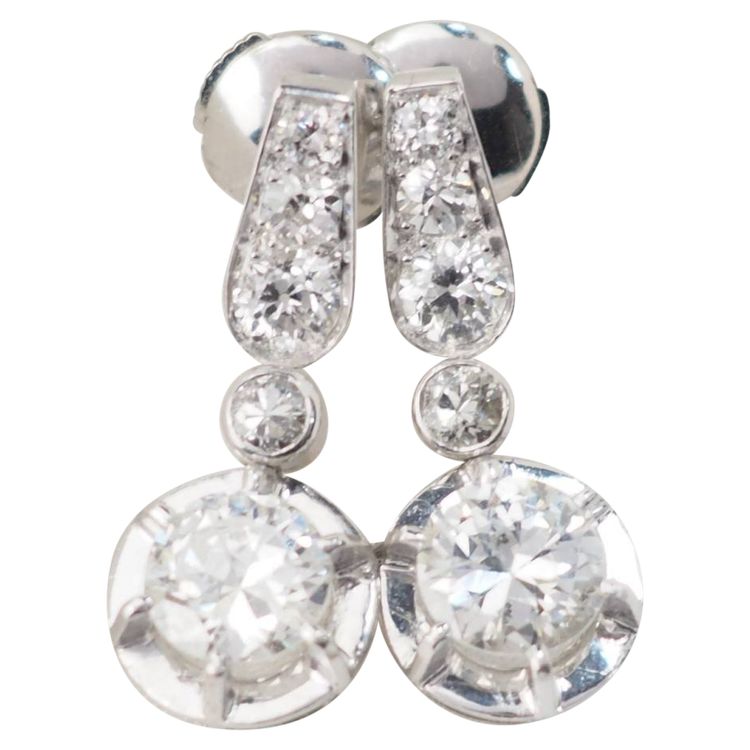 Pair of antique sleeper earrings in white gold and diamonds