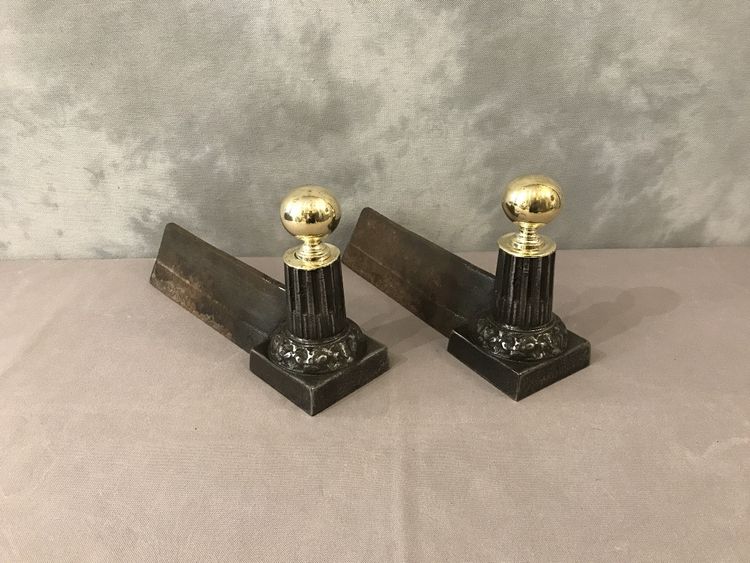 Pair of antique cast iron and brass andirons from the 19th century