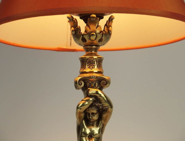 Pair of bronze "Atlantean" lamps