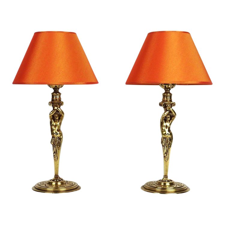 Pair of bronze "Atlantean" lamps