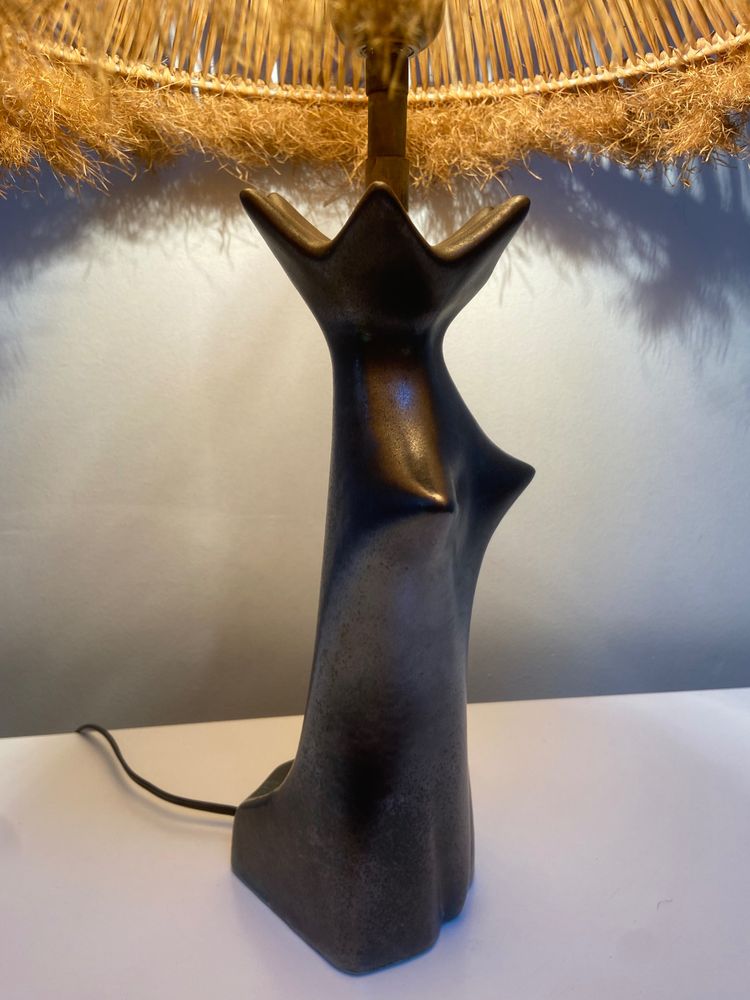 Black glazed ceramic lamp in the shape of a woman attributed to Jacques Blin