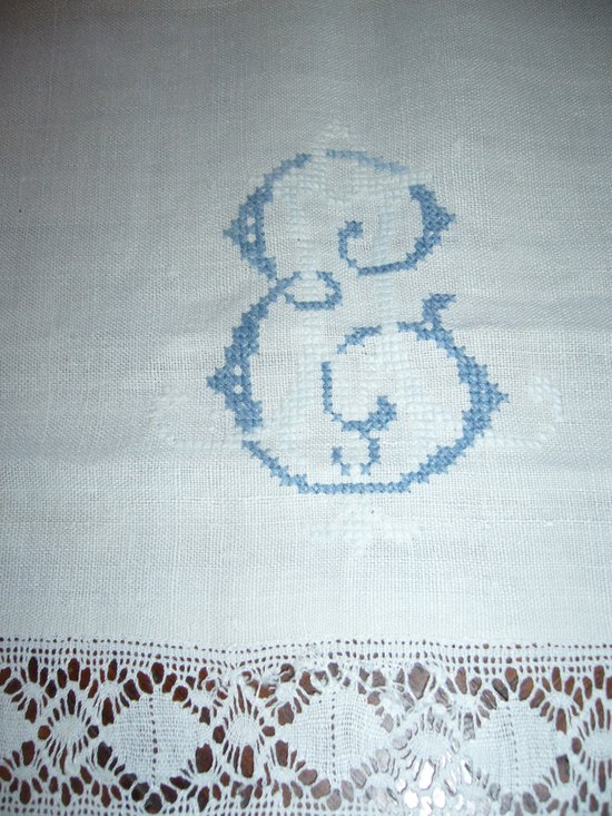 Embroidered linen and lace tablecloth, EA monogram circa 1900