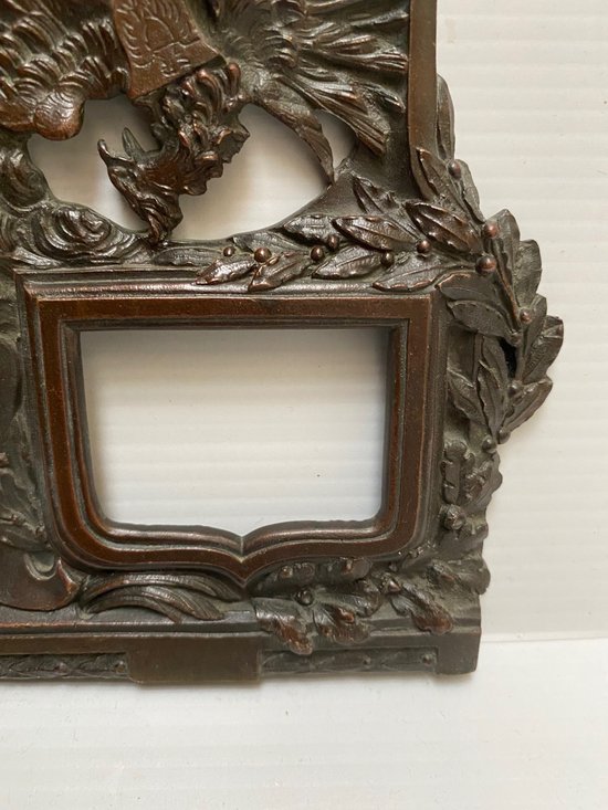 FRAME IN CAST BRONZE WITH PATINA