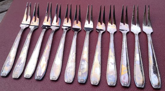 12 silver plated shellfish/snails forks, ribbon design