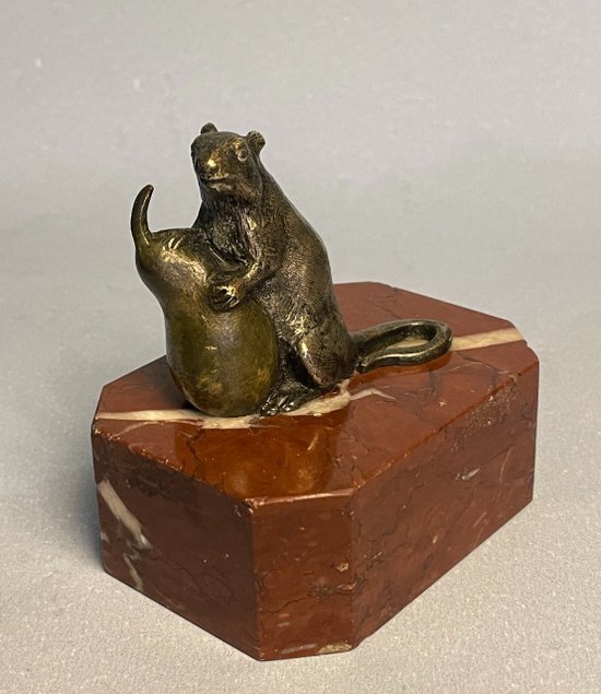 Mouse with a pear. Bronze sculpture from the 19th century