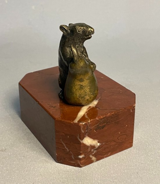 Mouse with a pear. Bronze sculpture from the 19th century