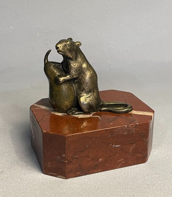 Mouse with a pear. Bronze sculpture from the 19th century