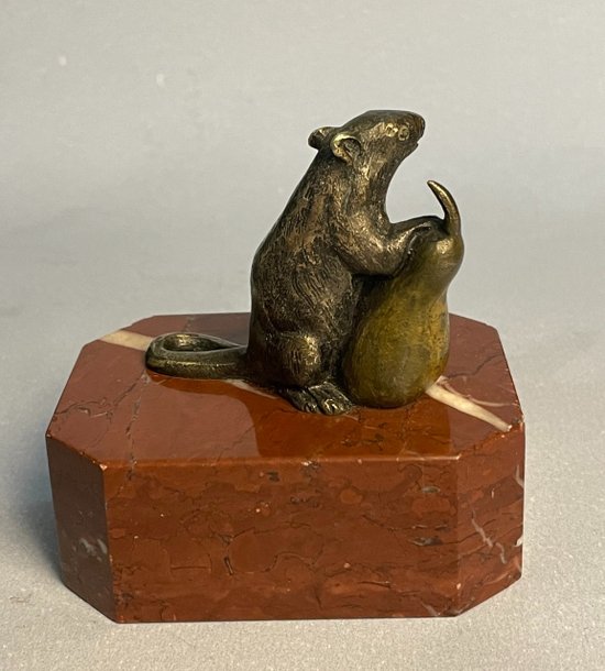 Mouse with a pear. Bronze sculpture from the 19th century