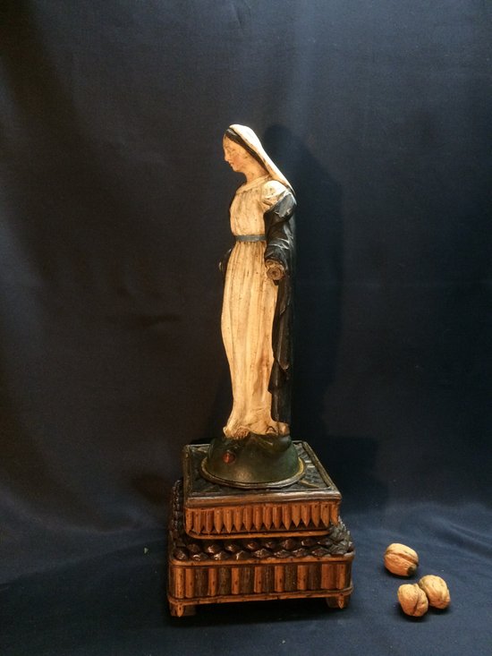 Virgin in wood carved on its support of the black forest.