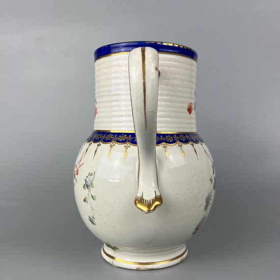 A late 18thc Derby jug hand painted in the manner of Edward Withers c.1775-80